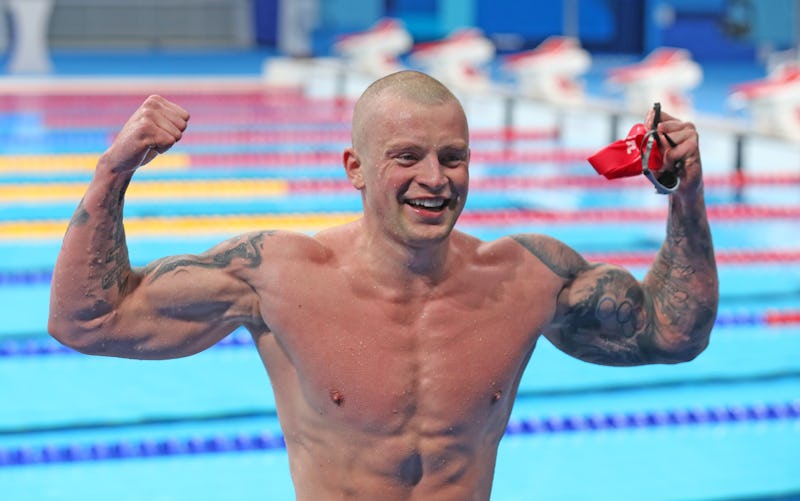 Gold medalist Adam Peaty of Great Britain poses for a photo after winning the men's 100m breaststrok...
