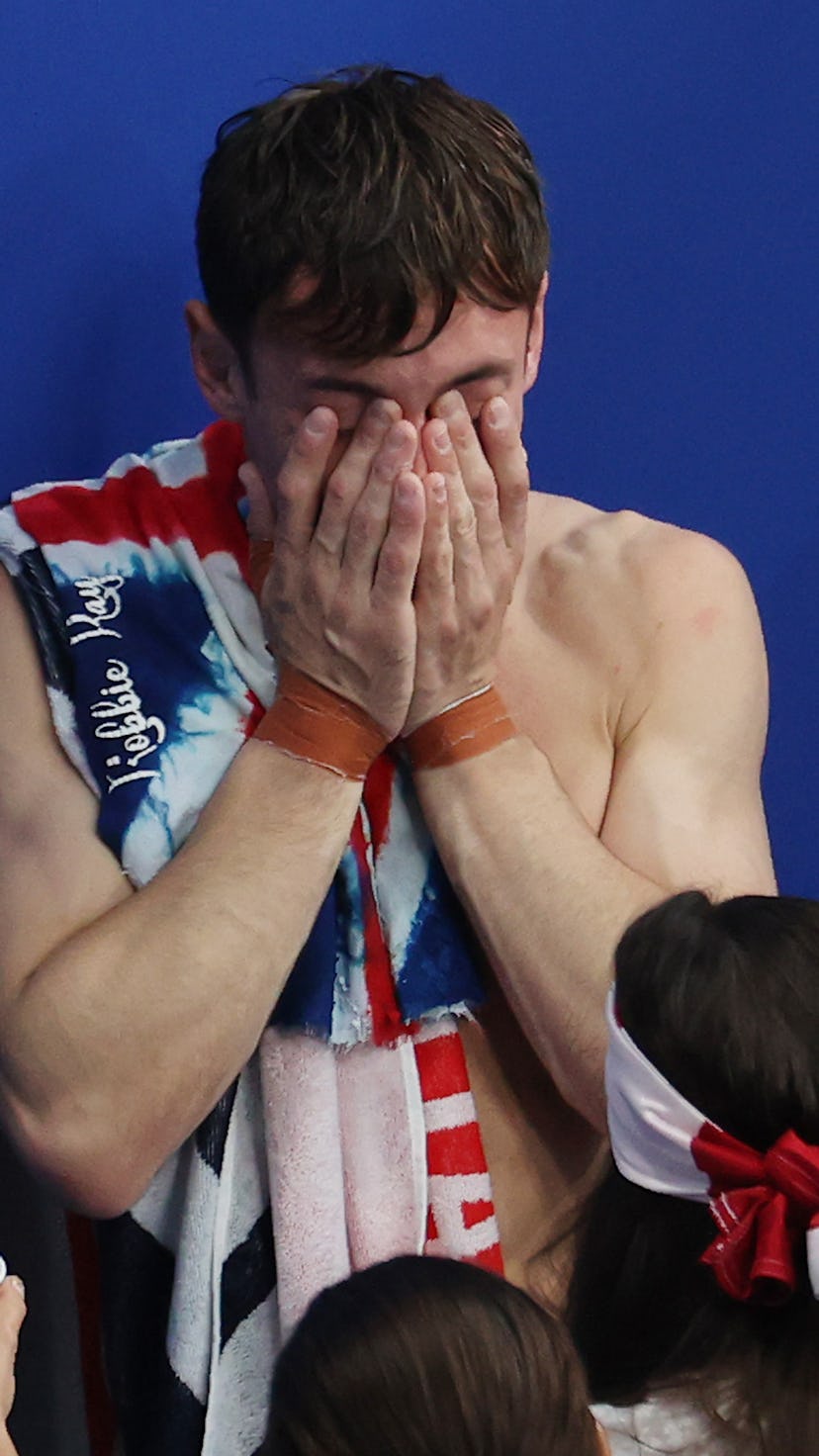 Tom Daley of Team Great Britain celebrates after winning gold.