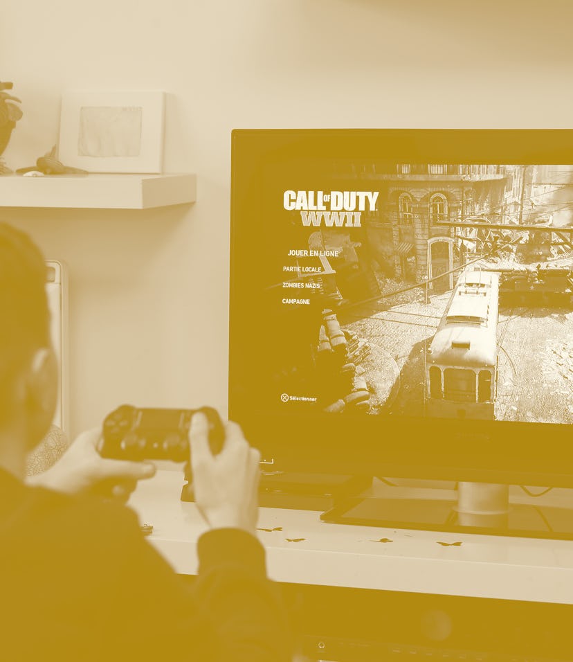 PARIS, FRANCE - DECEMBER 19: In this photo illustration a gamer plays the video game 'Call of Duty: ...