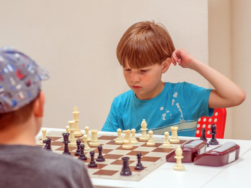 Two boys playing chess. 