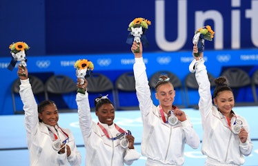 Silver medallists Simone Biles, Jordan Chiles, Grace McCallum, and Sunisa Lee (L-R) of the United St...