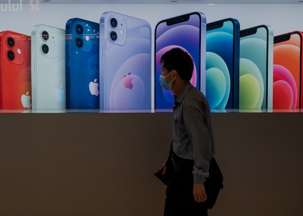 HONG KONG, CHINA - 2021/05/24: A shopper walks past the American multinational technology company Ap...