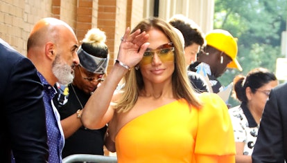 Jennifer Lopez wears yellow dress and bag while out and about in New York City on September 11, 2019...