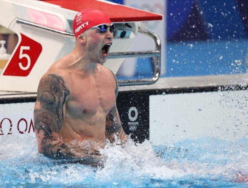 TOKYO, JAPAN - JULY 26: Adam Peaty of Team Great Britain reacts after winning the gold medal in the ...