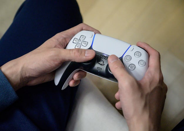 In a photo taken on November 12, 2020, a gamer plays on the new Sony Playstation PS5 at his home in ...