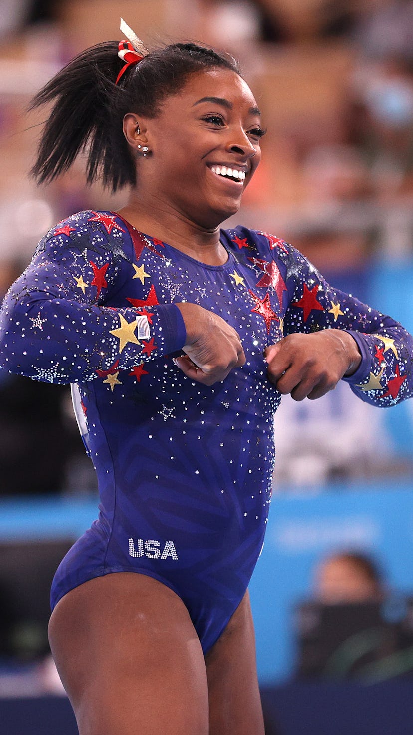 Simone Biles reacts after competing on balance beam during Women's Qualification on day two of the T...