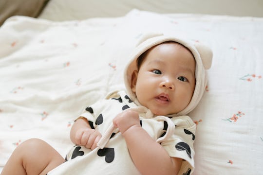 baby girl with cat ears hat on