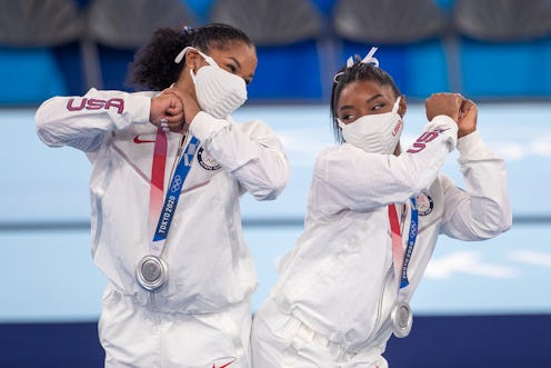 Simone Biles and Jordan Chiles of the United States bump hips at the Tokyo Olympics. Here's why gymn...