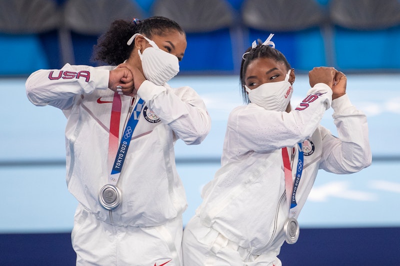 Simone Biles and Jordan Chiles of the United States bump hips at the Tokyo Olympics. Here's why gymn...
