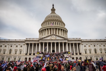 WASHINGTON, DC - JANUARY 06: A large group of pro-Trump protesters stand on the East steps of the Ca...
