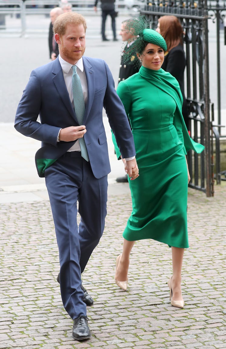 Meghan Markle is shown here in an emerald green ensemble consisting of a dress and matching scarf an...