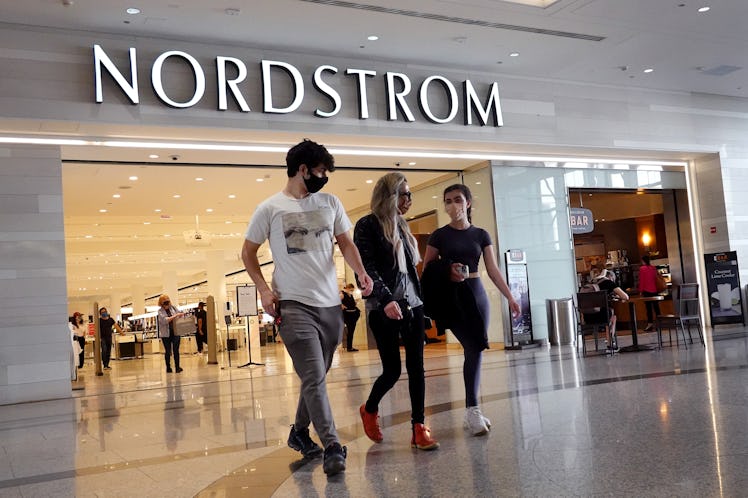 Shoppers leaving a Nordstrom, which is currently having the Nordstrom Anniversary Sale and discounti...