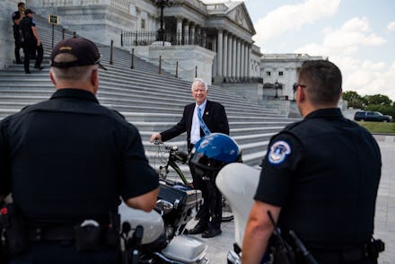 UNITED STATES - JUNE 30: Rep. Mo Brooks, R-Ala., talks with U.S. Capitol Police before a House vote ...