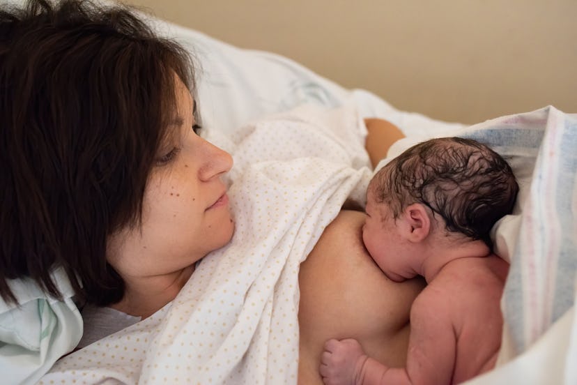 woman breastfeeding her newborn