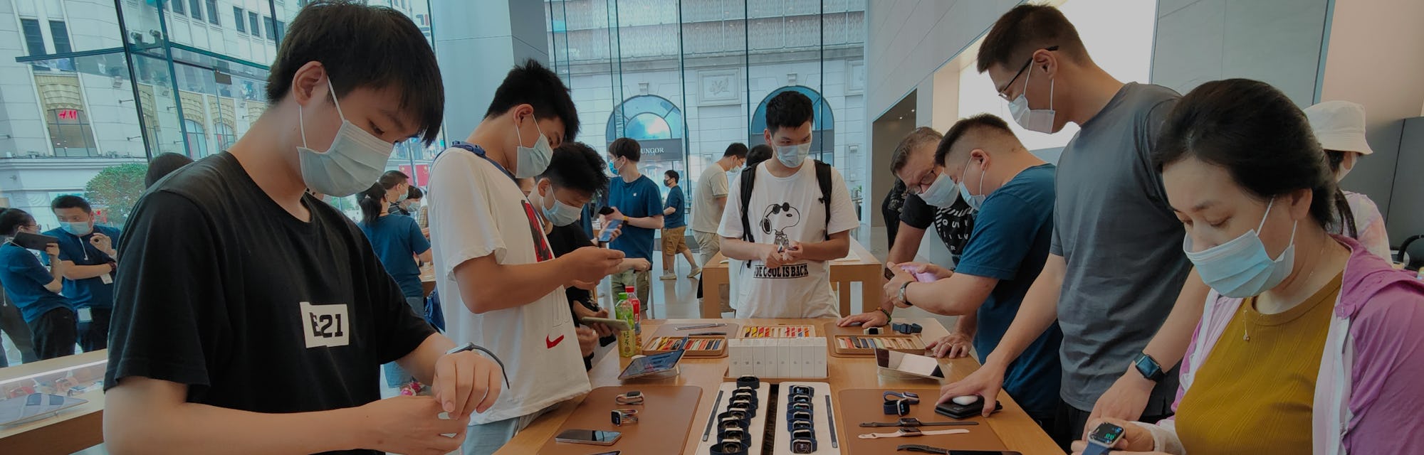 SHANGHAI, CHINA - JULY 2, 2021 - Consumers pick up a trial of Apple Watch Series 6 and Apple Watch S...