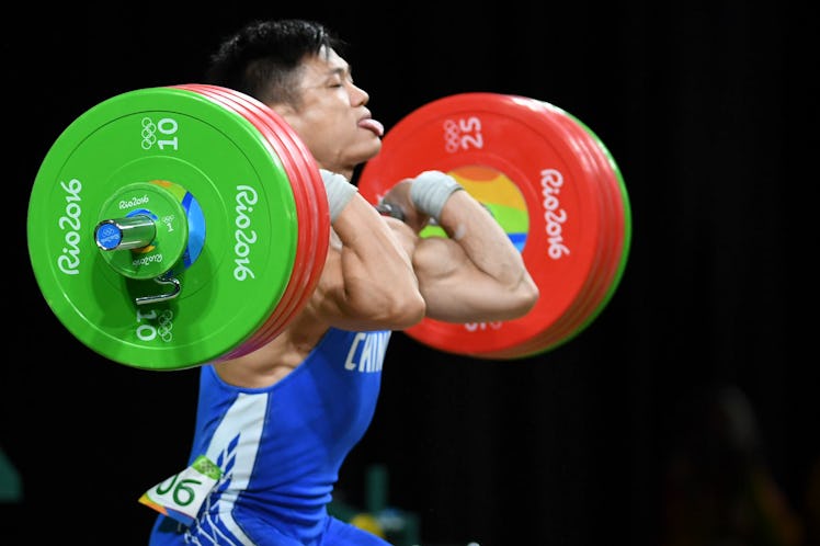 Lyu Xiaojun of China competes during the Men's 77kg weightlifting contest on Day 5 of the Rio 2016 O...