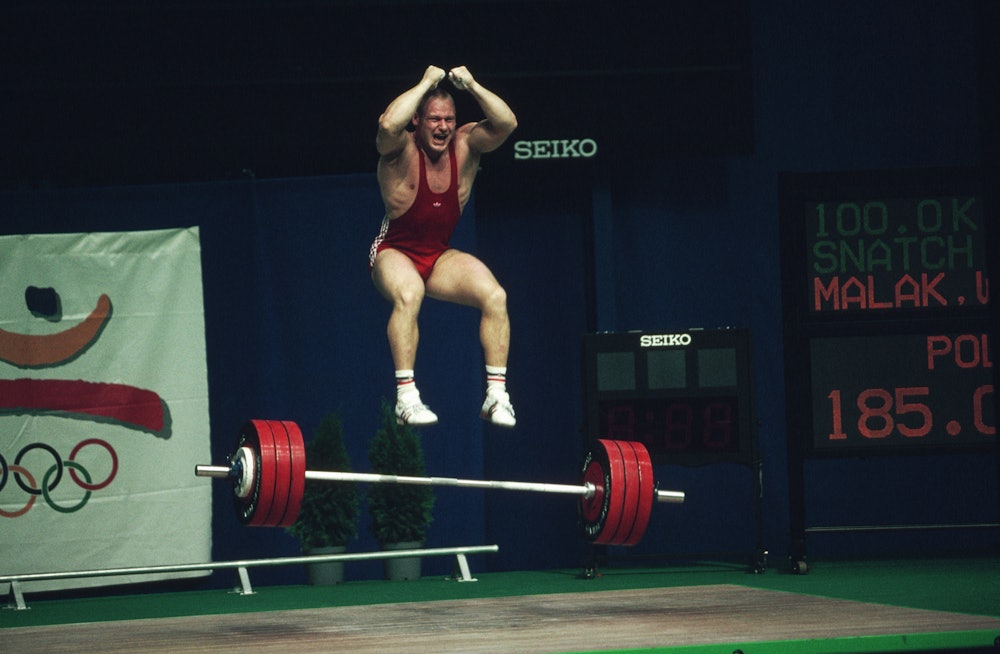 Malak takes a jump after lifting at the 1992 Barcelona Olympic Games. | Location: Barcelona, Spain. ...