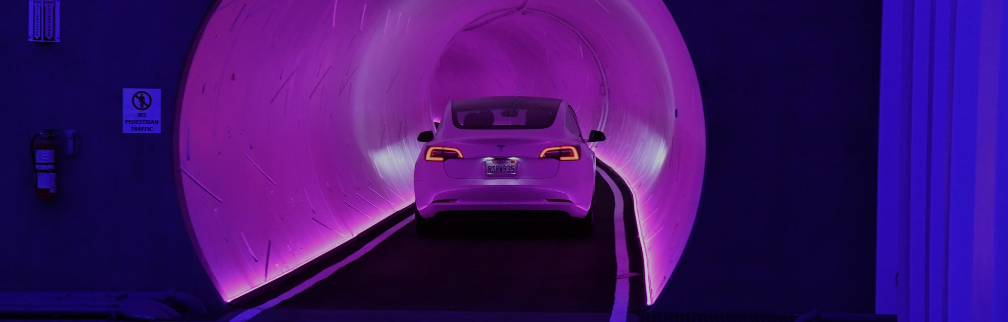LAS VEGAS, NEVADA - APRIL 09: A Tesla car drives through a tunnel in the Central Station during a m...