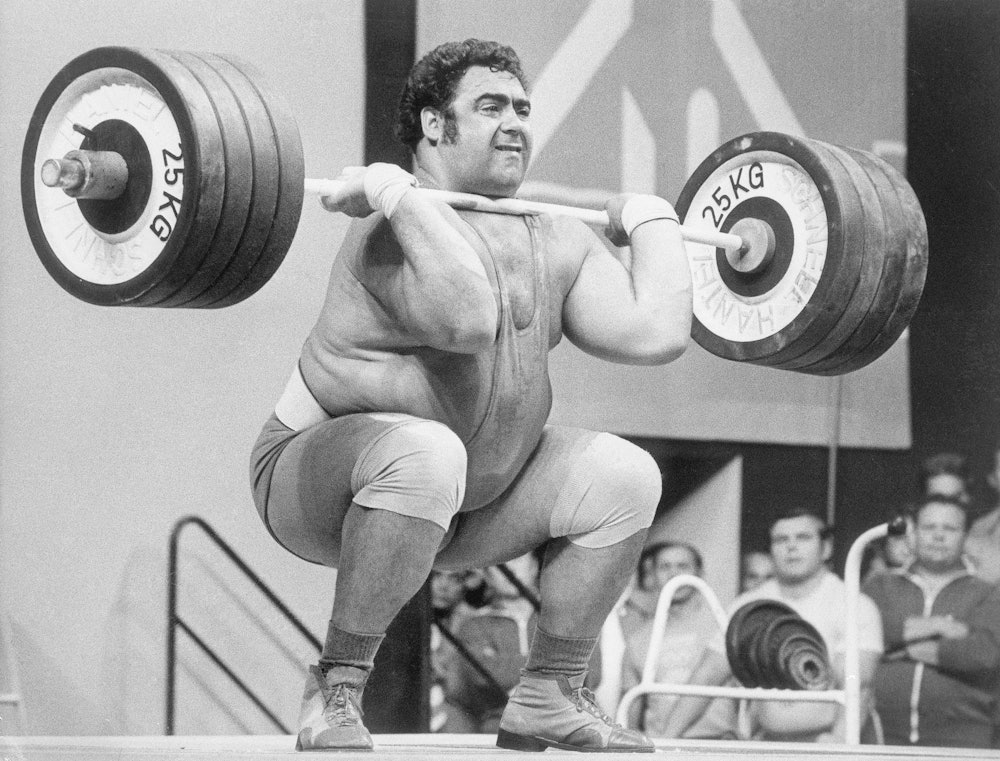 (Original Caption) 9/6/1972-Munich, Germany- Soviet Union's Vassili Alexeev sets a new Olympic world...