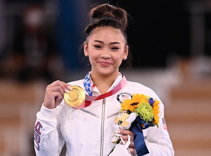USA's Sunisa Lee poses with her gold medal during the podium ceremony of the artistic gymnastics wom...