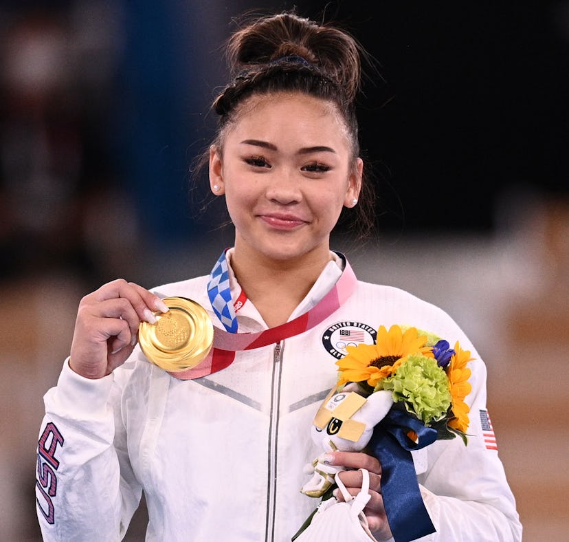 USA's Sunisa Lee poses with her gold medal during the podium ceremony of the artistic gymnastics wom...