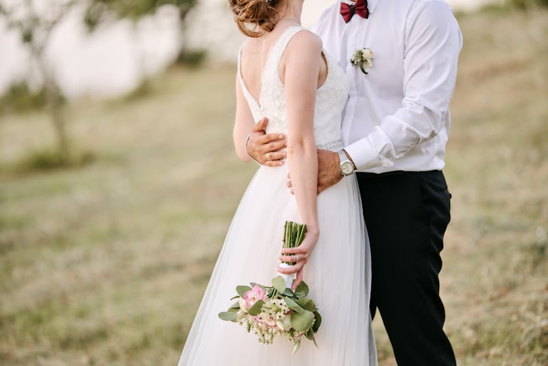 Bride and groom hugging each other