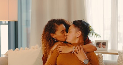 Woman who invited her friend with benefits over gets a kiss.