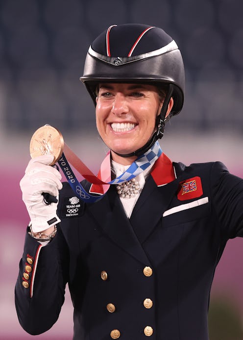 TOKYO, JAPAN - JULY 28: Charlotte Dujardin of Team Great Britain who rode Gio celebrates with their ...