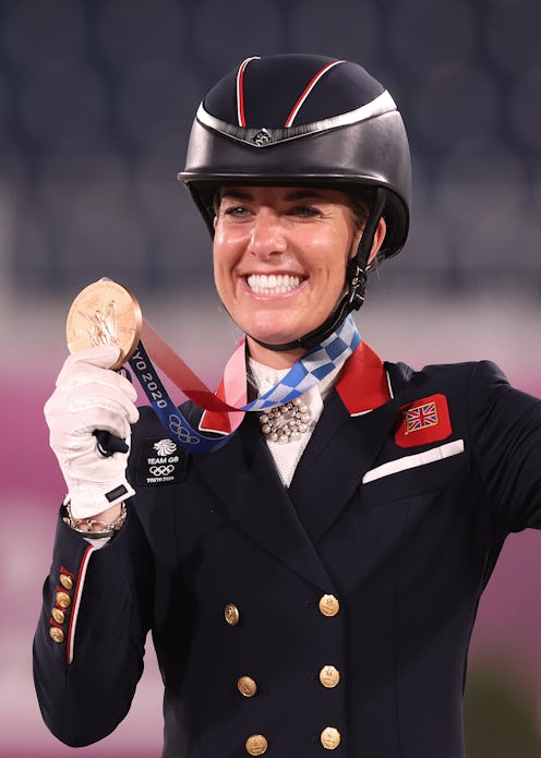 TOKYO, JAPAN - JULY 28: Charlotte Dujardin of Team Great Britain who rode Gio celebrates with their ...