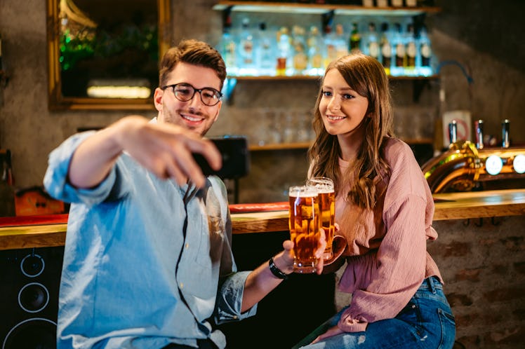 Girl at bar trying to think of a way to turn down a man flirting with her.