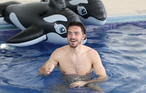 BURTON UPON TRENT, ENGLAND - JULY 04: Jack Grealish of England reacts in the swimming pool at St Geo...
