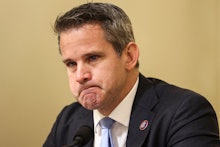 US Representative Adam Kinzinger becomes emotional as he questions witnesses during the Select Commi...