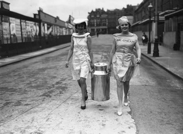 10th October 1938:  A churn of ice cream is carried into the Olympia Exhibition Centre in readiness ...