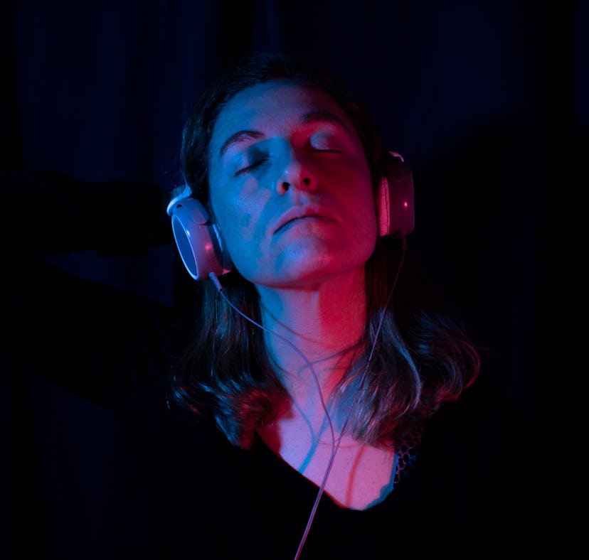 A woman listens to songs about cheating.