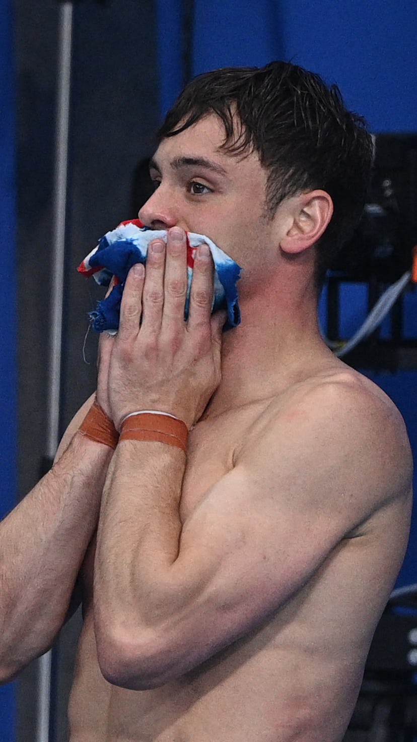 Britain's Thomas Daley waits with Britain's Matty Lee (unseen) to hear the result of the men's synch...