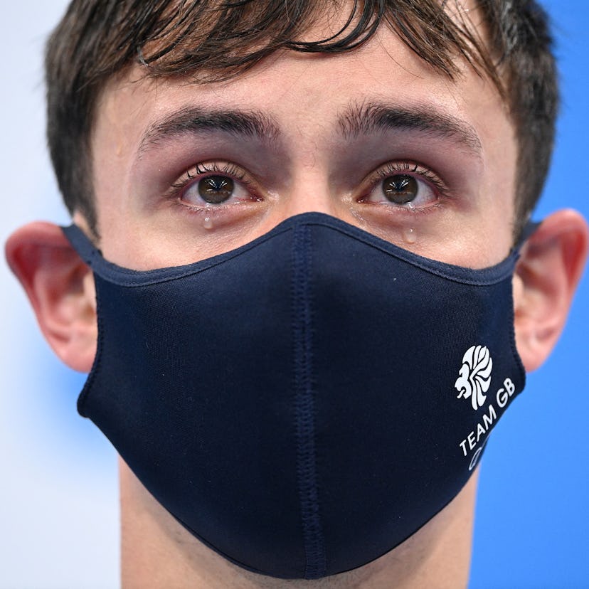 TOPSHOT - Tears well in the eyes of gold medallists Britain's Thomas Daley and Britain's Matty Lee (...