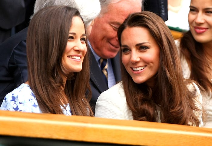 Kate and sister Pippa Middleton laugh in the Royal box in the Final at Wimbledon, 2012 (Photo by AMA...
