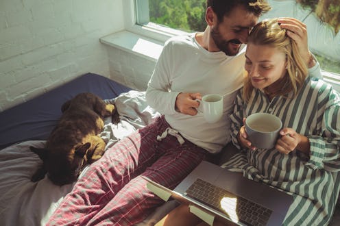 A couple drinks coffee in bed. Drinking coffee before sex can improve certain aspects of sex, an exp...