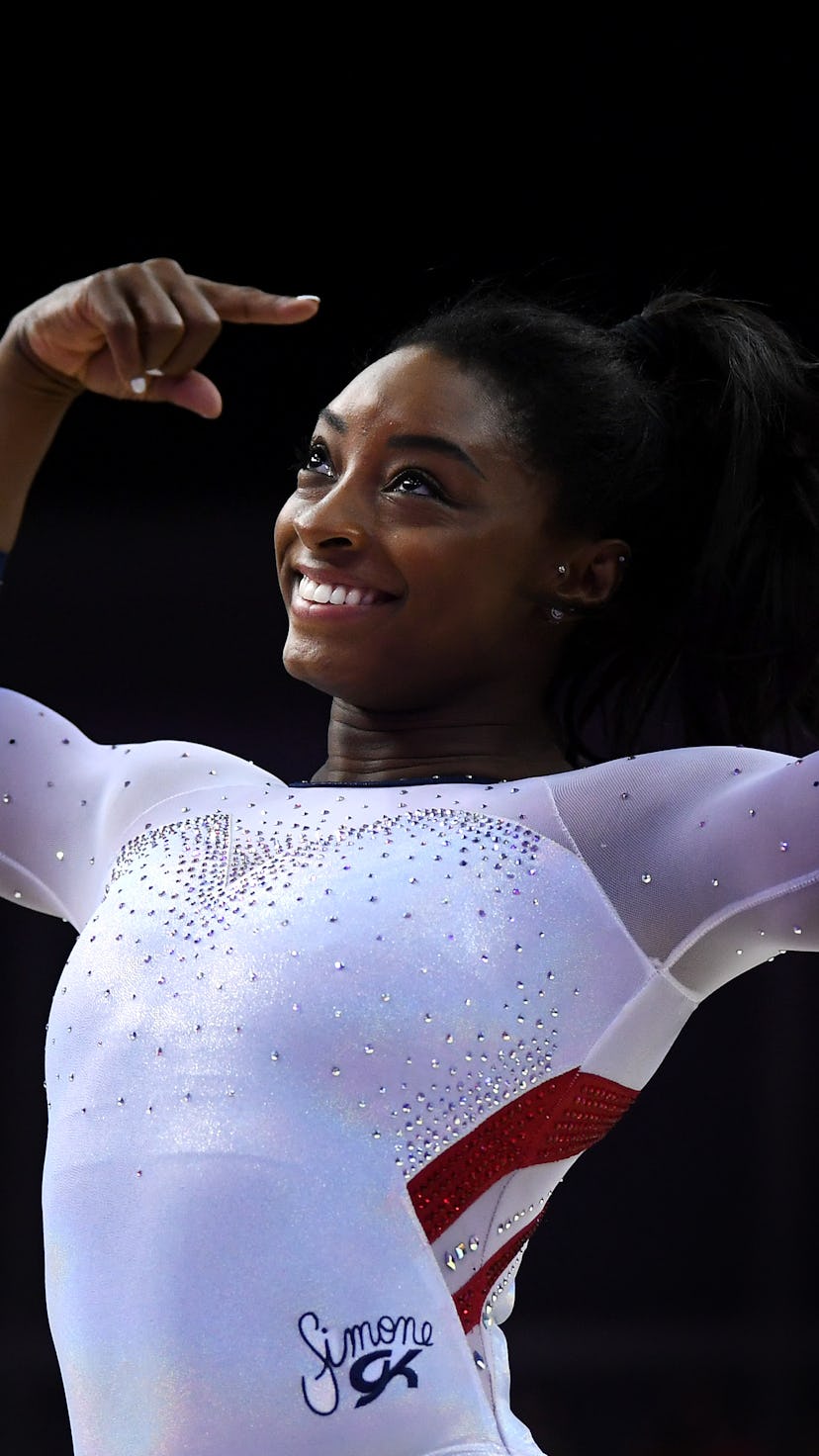 LONDON, ENGLAND - MARCH 23: Simone Biles of the USA reacts after finishing her her performance on ba...