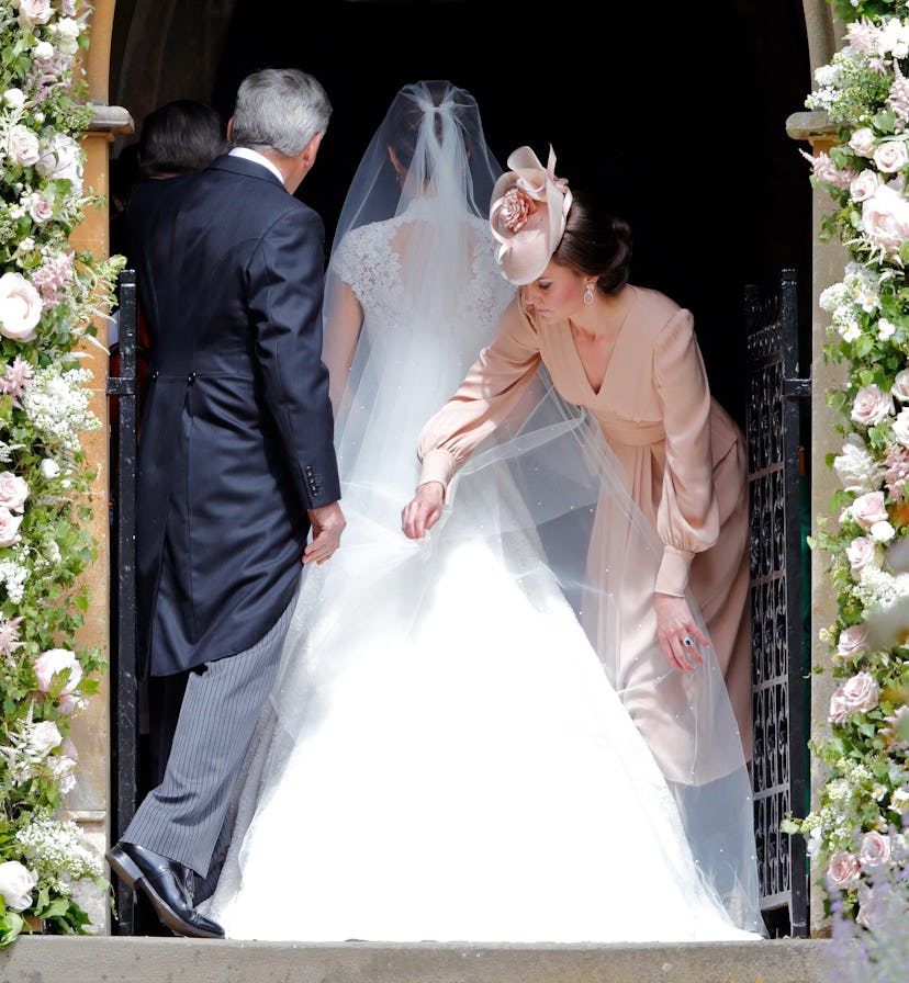 Kate Middleton helps her sister on her wedding day.
