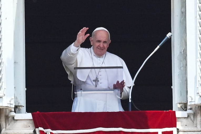 TOPSHOT - Pope Francis delivers the Sunday Angelus prayer from the window of his study overlooking S...