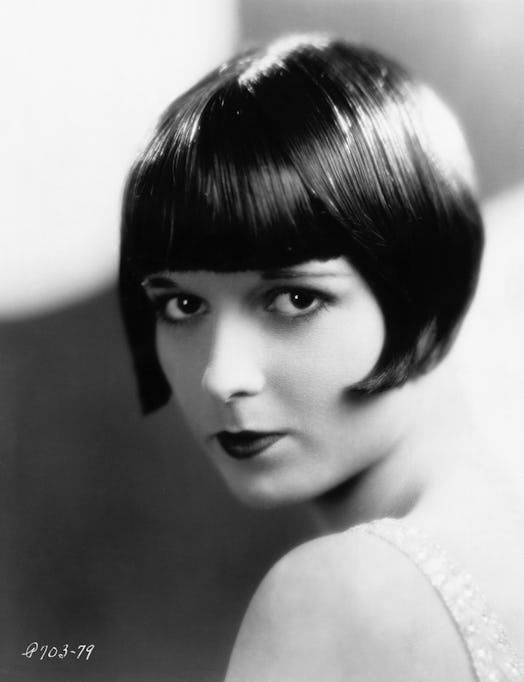 Louise Brooks donning the signature blunt bang and bob cut of the flapper era. 