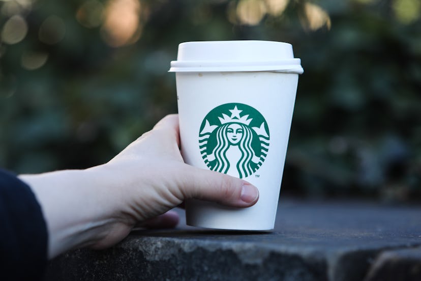 Starbucks Coffee logo is seen on disposable paper cup is seen in this illustration photo taken in Pr...