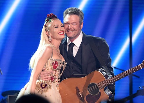 LOS ANGELES, CALIFORNIA - JANUARY 26: Gwen Stefani and Blake Shelton pose onstage during the 62nd An...