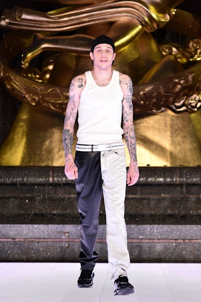 Pete Davidson, pictured here with his arm tattoos showing at a fashion show, is getting his tats rem...