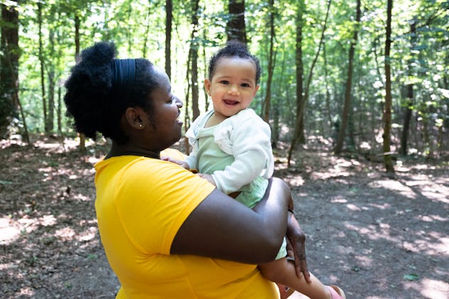 Mother and baby girl with a rare name in forest