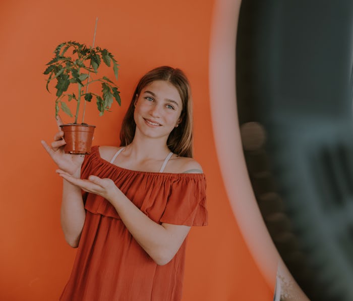 TikTok influencer holding a pot plant