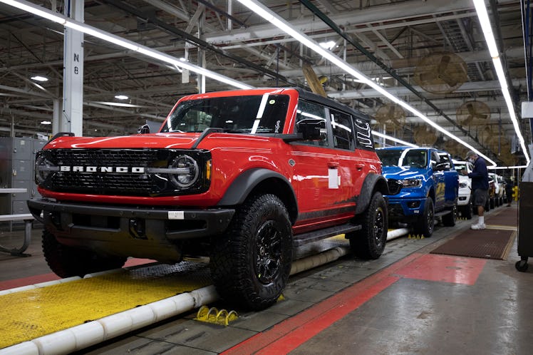 WAYNE, MI - JUNE 14: A 2021 Ford Bronco (foreground) and a 2021 Ford Ranger (background) go through ...