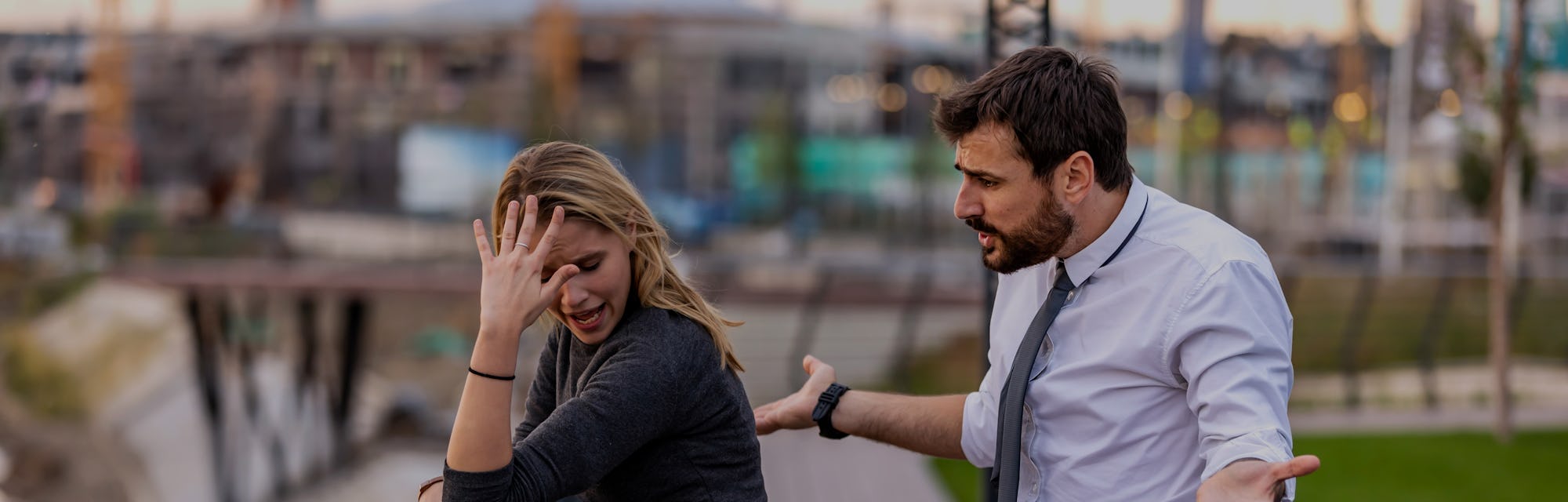 Handsome Young Man is Having Harsh Debate with his Beautiful Girlfriend with Long Hair while Taking ...