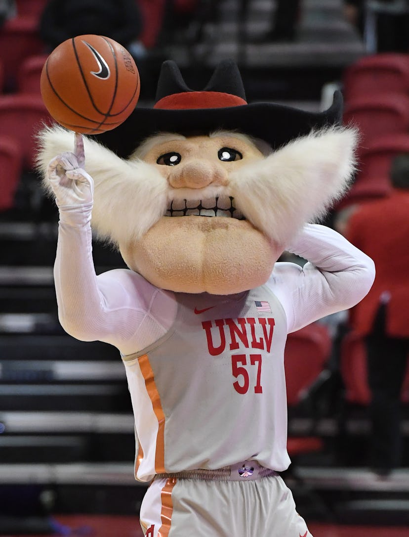 LAS VEGAS, NEVADA - NOVEMBER 28:  UNLV Rebels mascot Hey Reb spins a basketball on his finger before...
